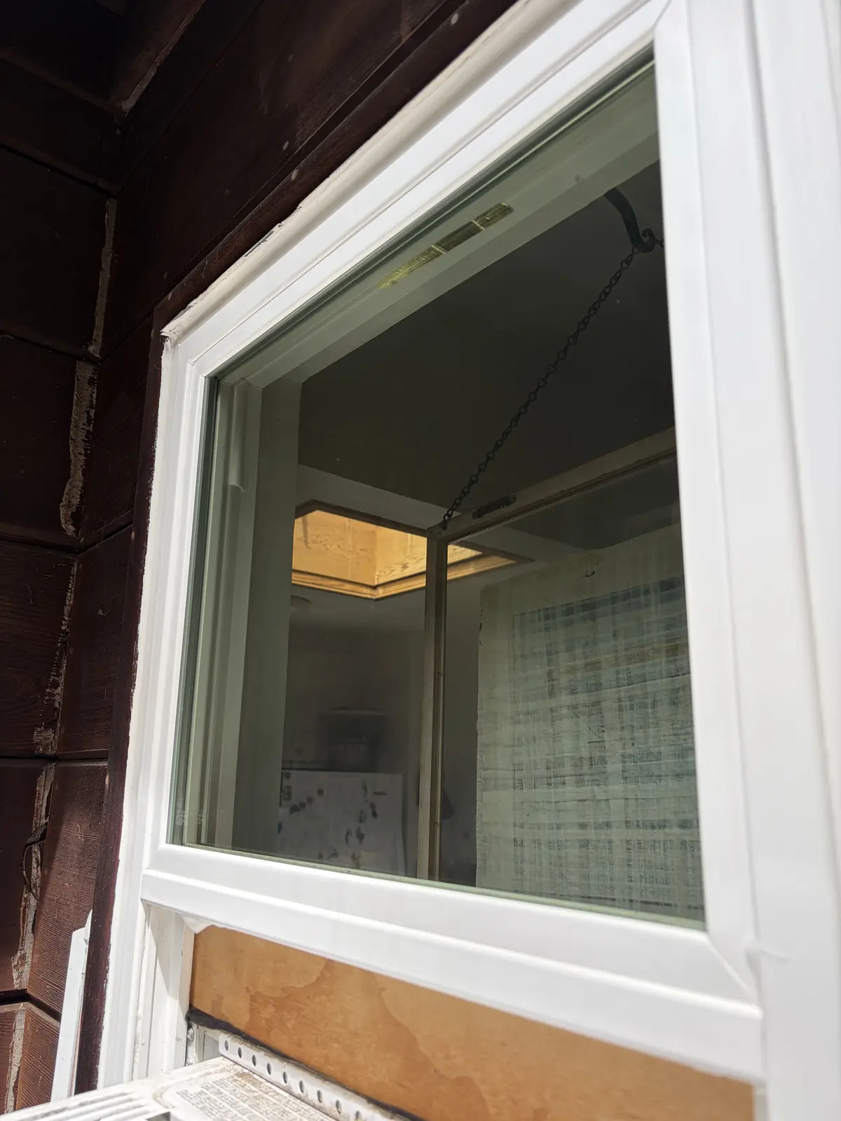 After: the same window cleaned to clear glass