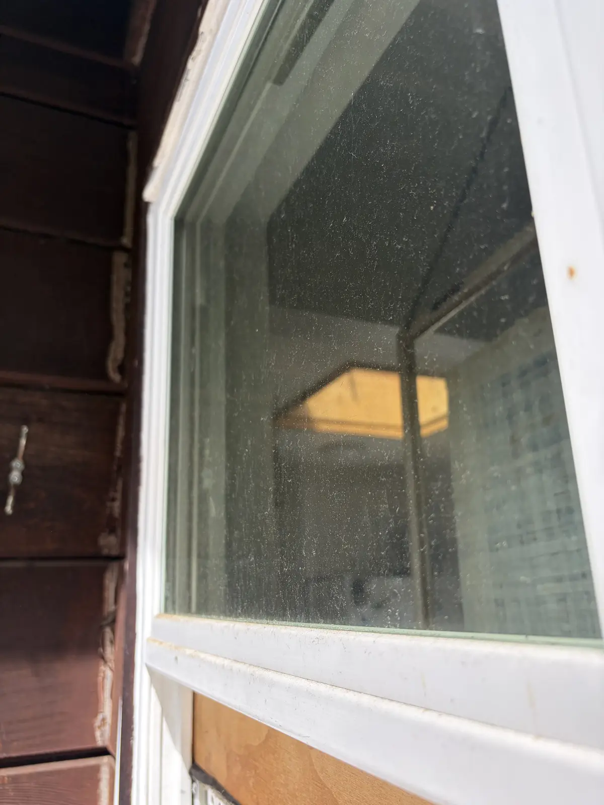 Before: window glass covered in dust and grime